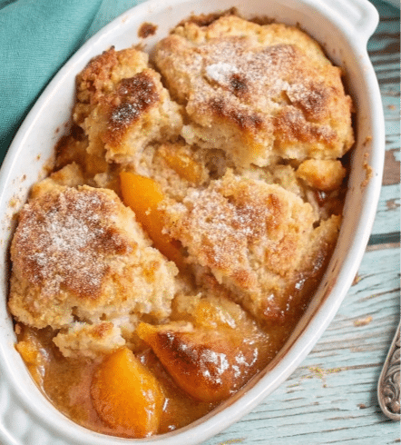 peach-cobbler-filling-prep.png mixing peach cobbler filling with spices and sugar