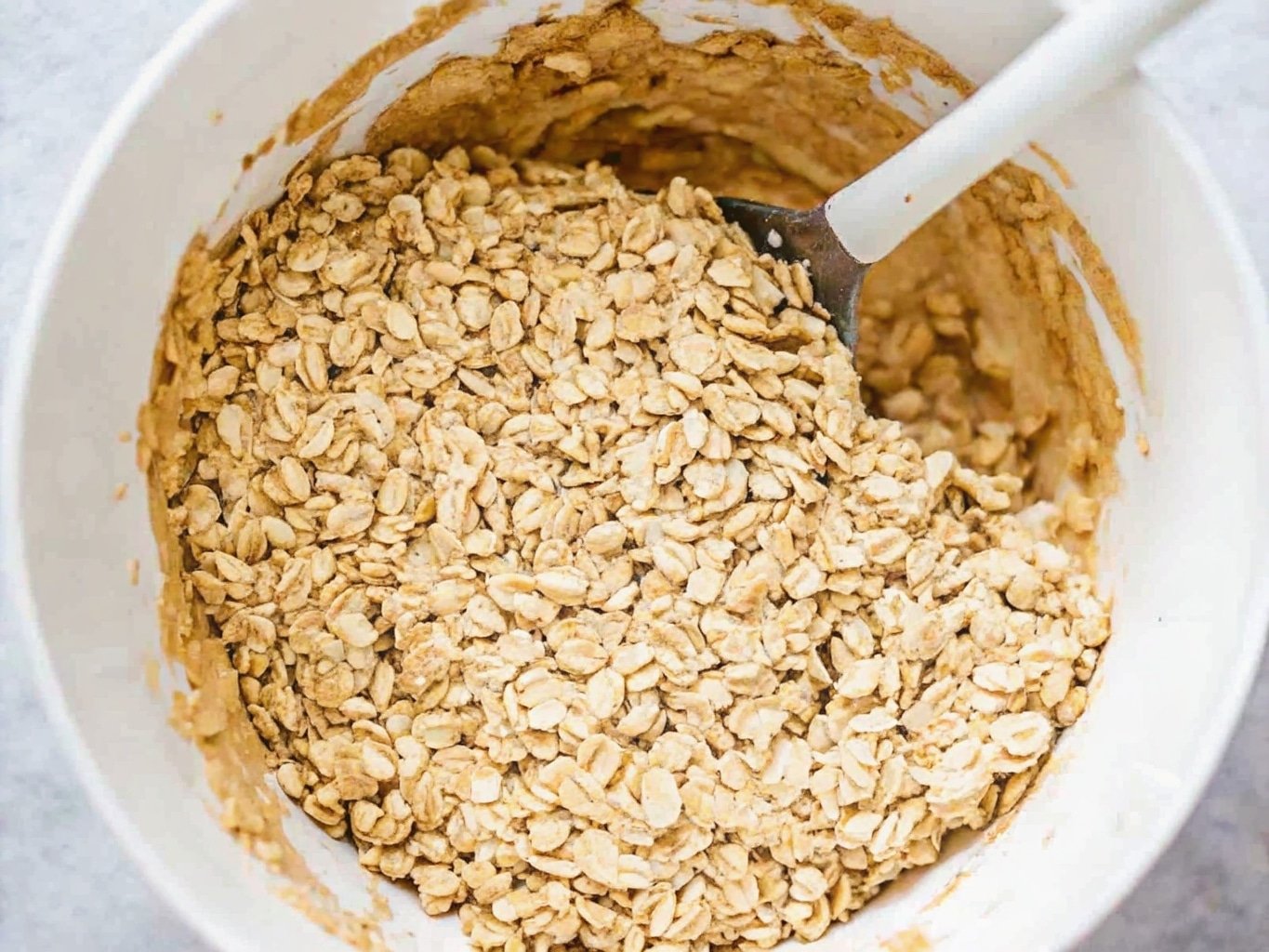 Oatmeal cookie dough scoops on baking sheet